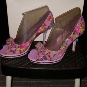 3 and a 1/2 inch platform lilac butterfly pumps